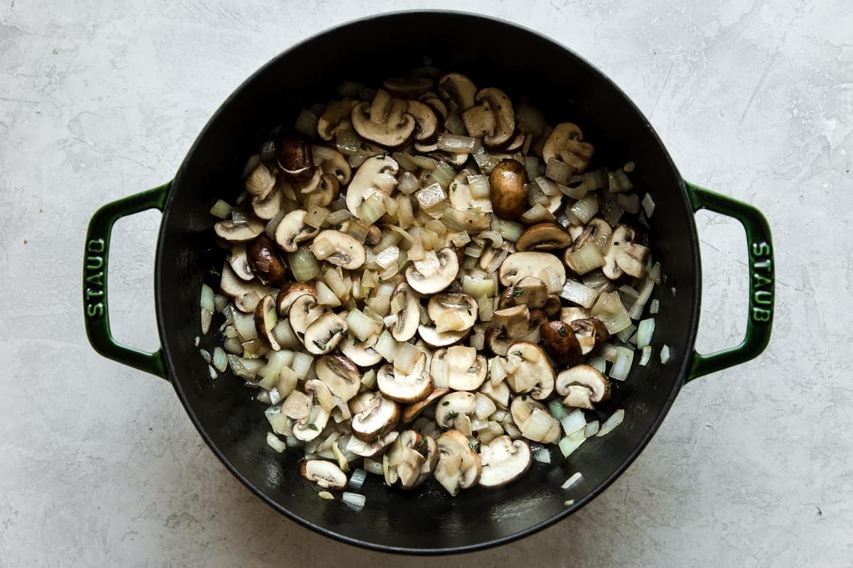 onions and mushrooms sauteed in a dutch oven for strata