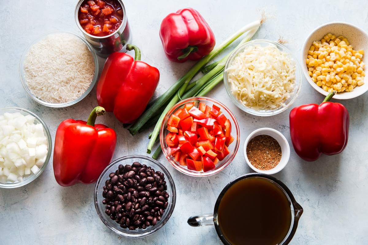 ingredients for vegetarian stuffed bell peppers in small bowls