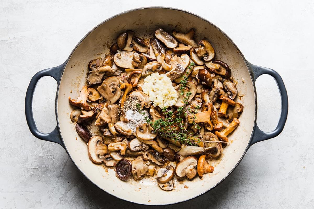 cooked wild mushrooms with garlic, shallots and thyme  in a skillet