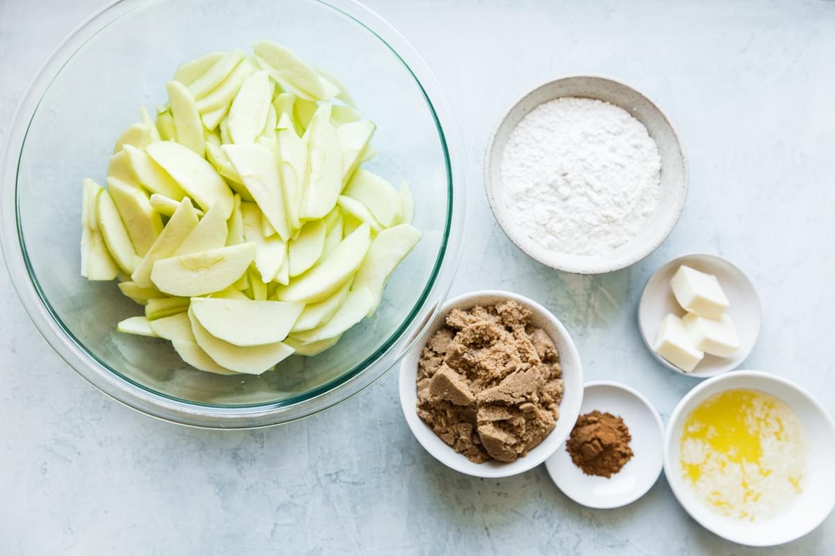 ingredients for apple crisp in small bowls