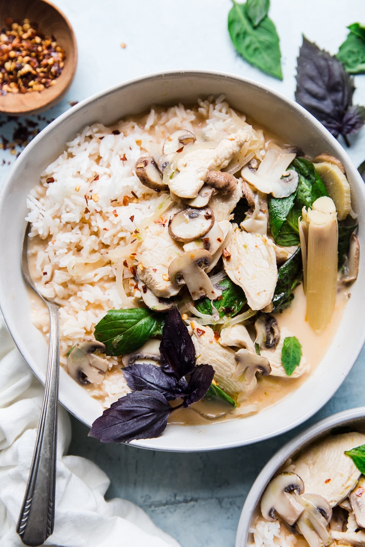 Coconut Chicken Soup Tom Kha Gai in a bowl with mushrooms
