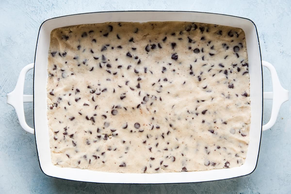 chocolate chip cookie brittle dough pressed into a baking dish
