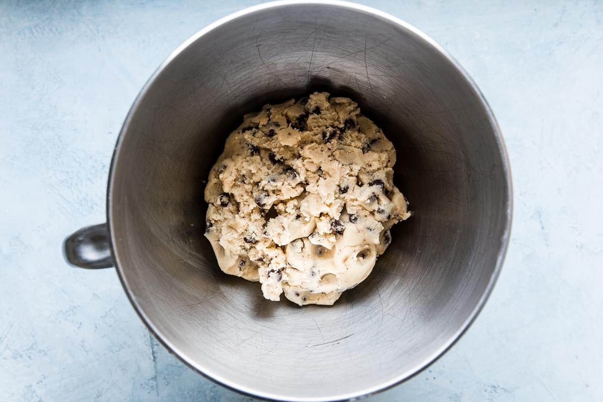 chocolate chip cookie brittle dough in a mixing bowl