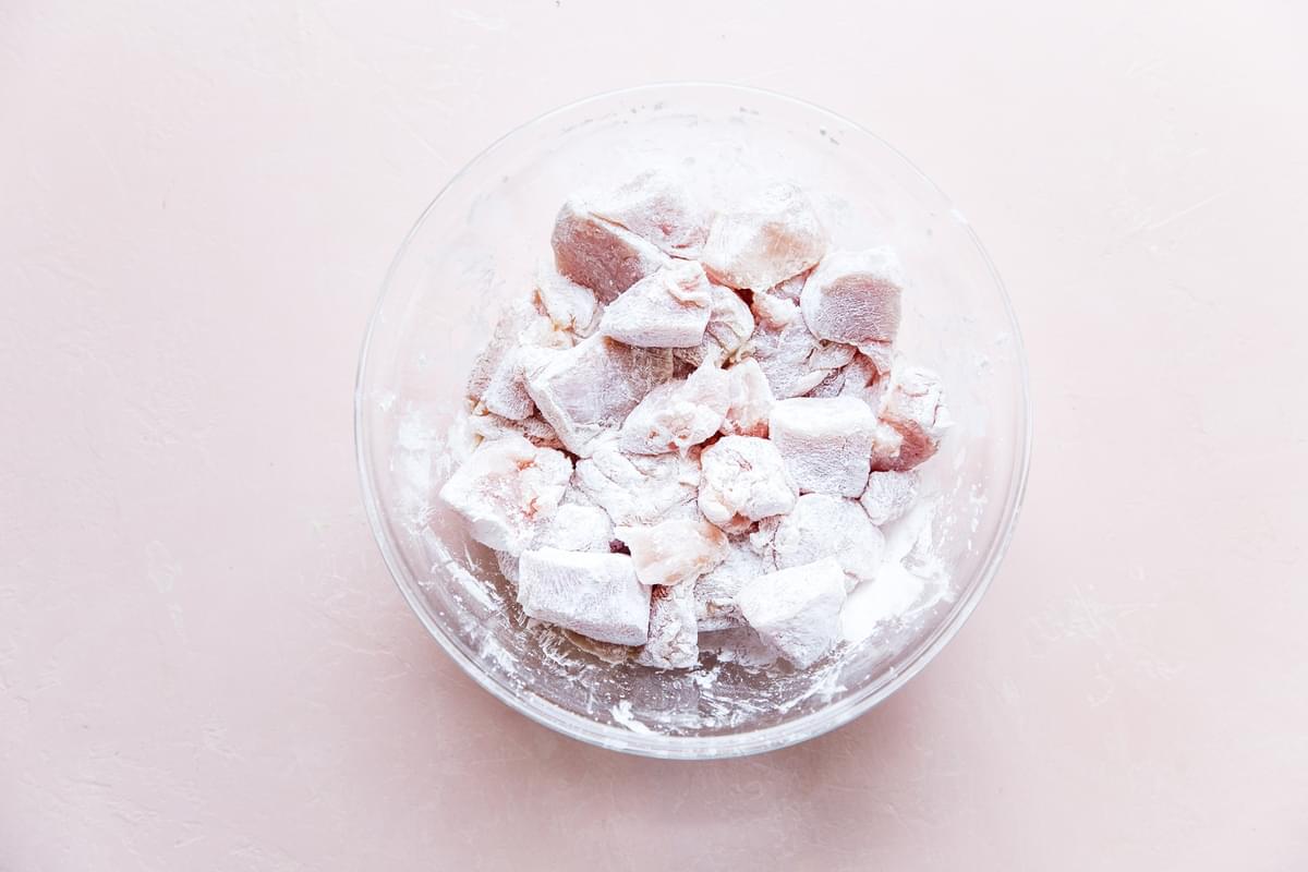 raw chicken in a bowl with corn starch