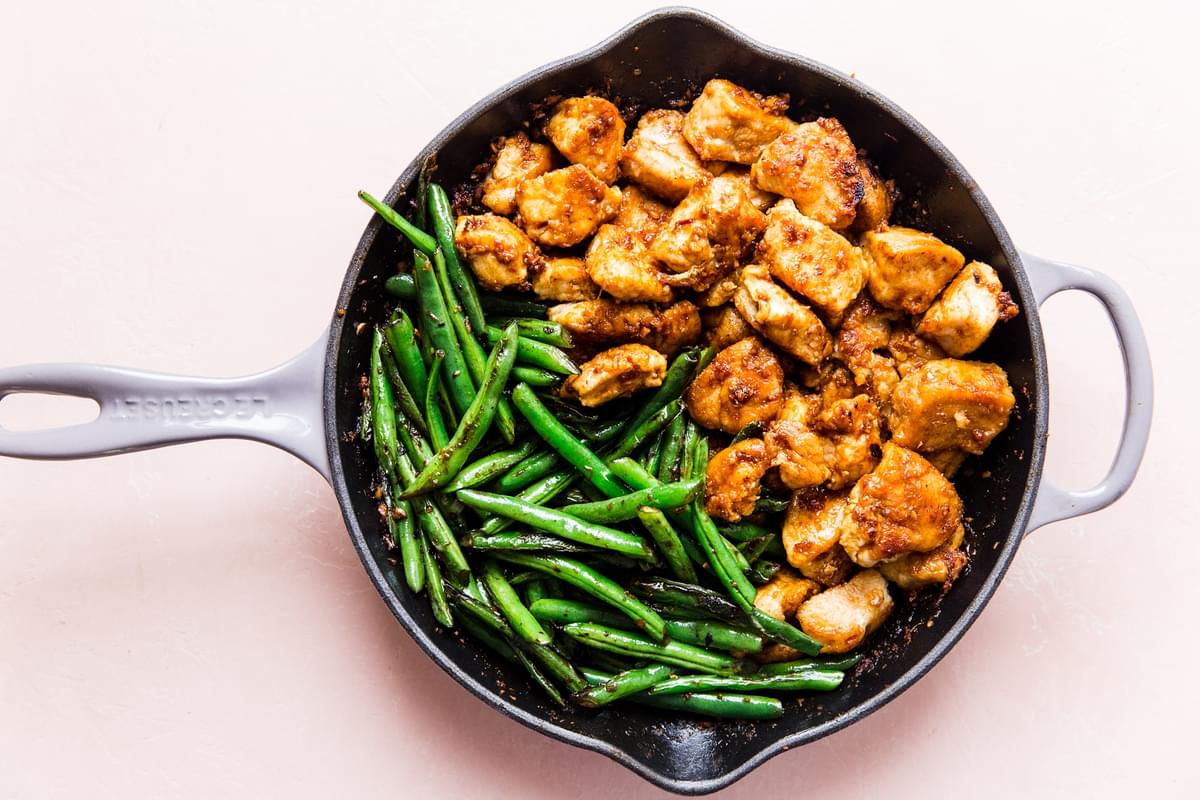 green beans and crispy chicken in a sauté pan for homemade chicken starry recipe