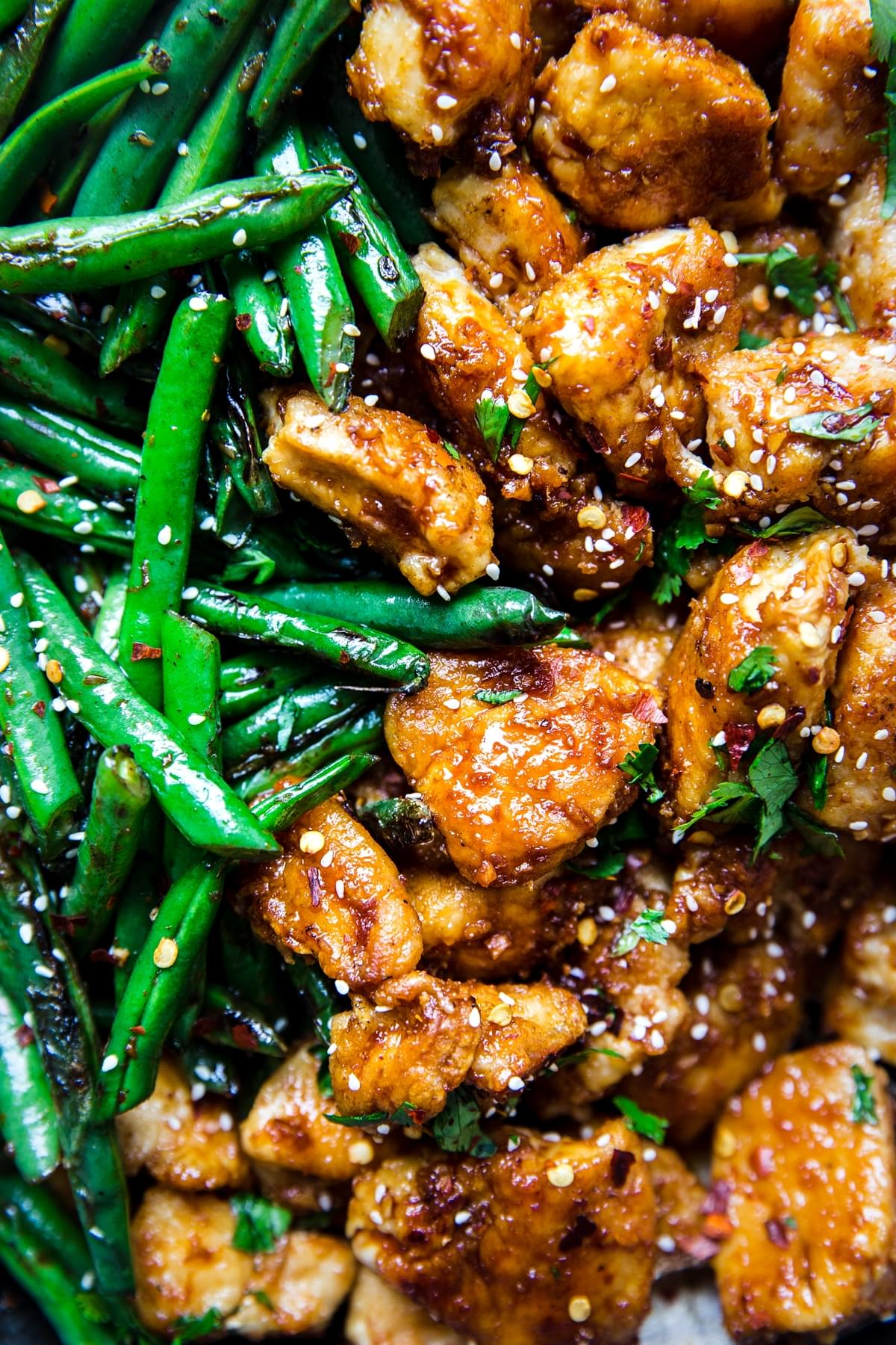 close up of crispy chicken and green beans