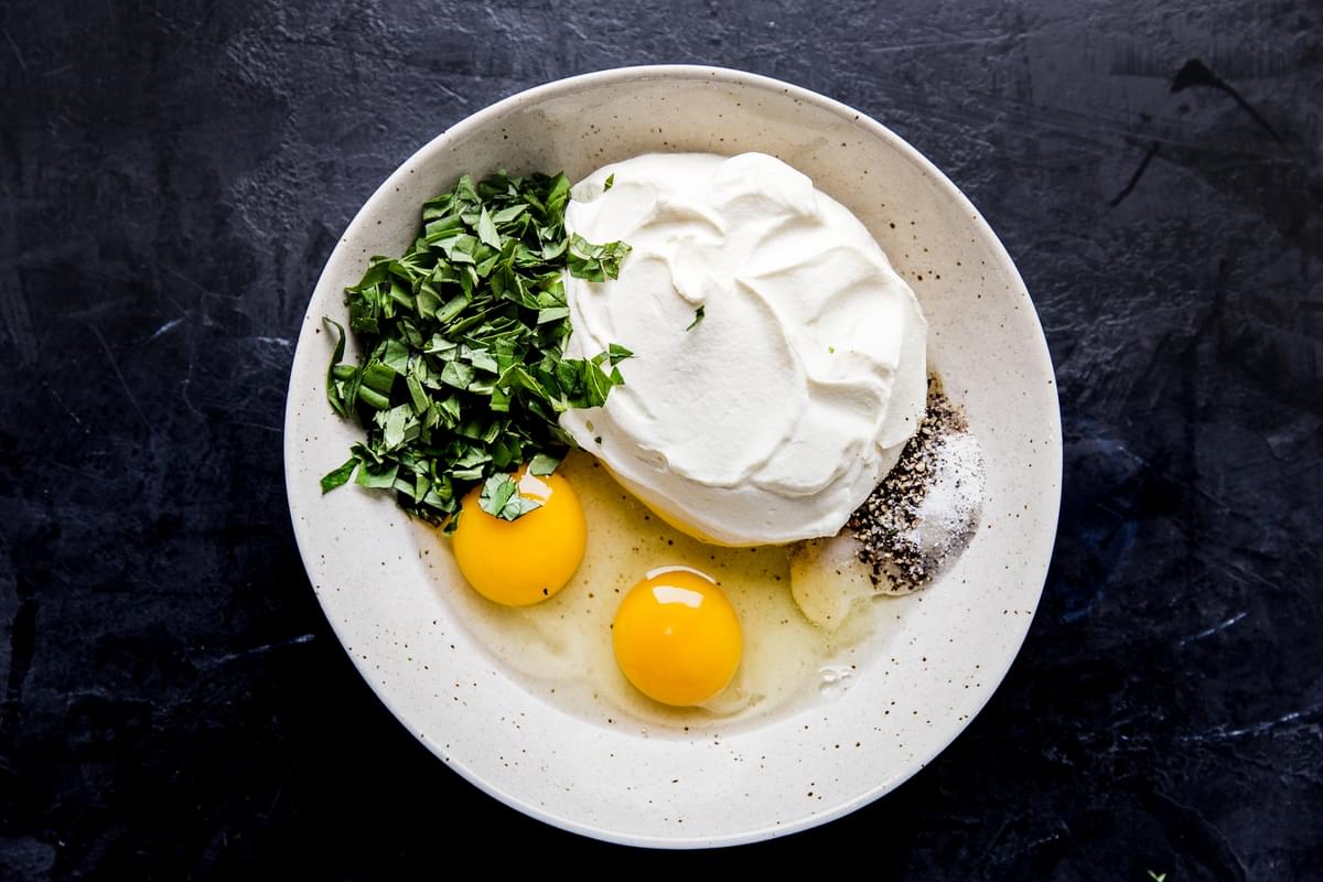 chopped parsley, ricotta, eggs salt and pepper in a bowl