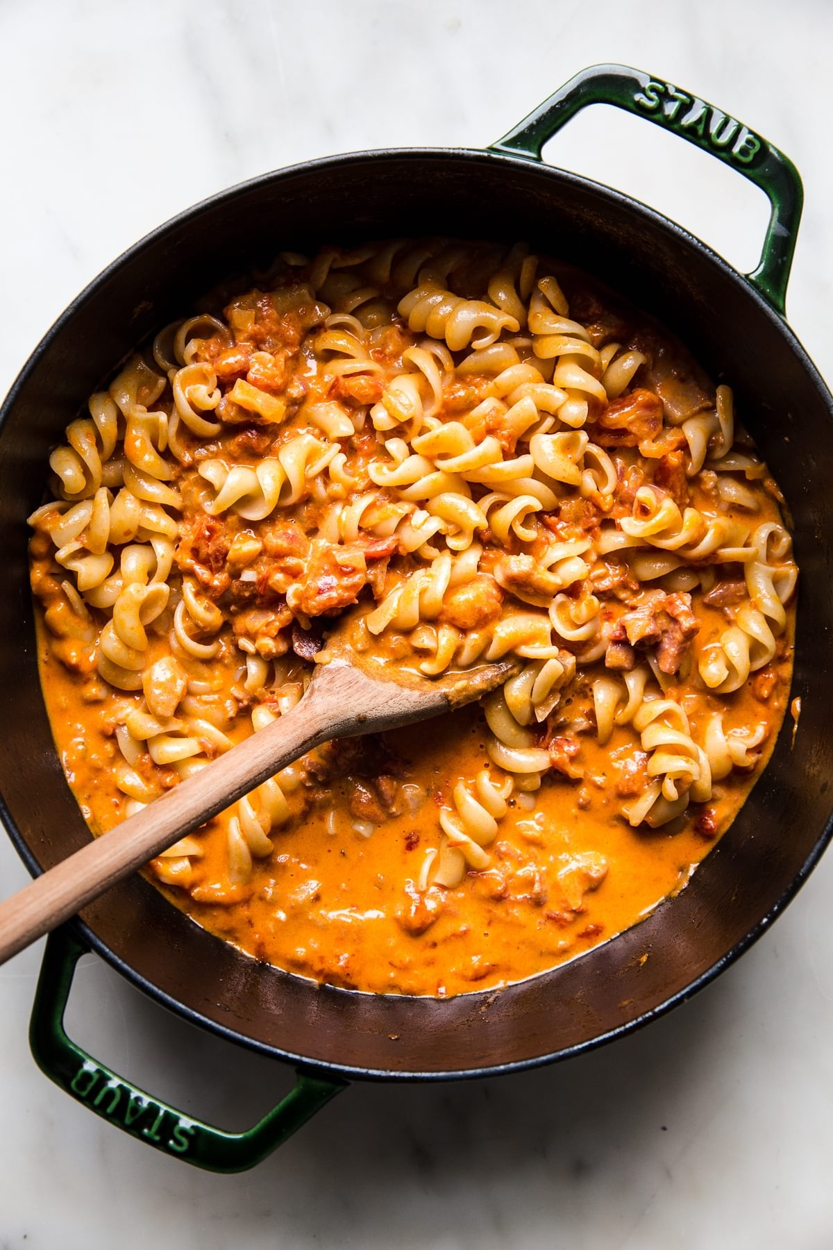 pasta added to easy homemade vodka sauce recipe in a soup pot