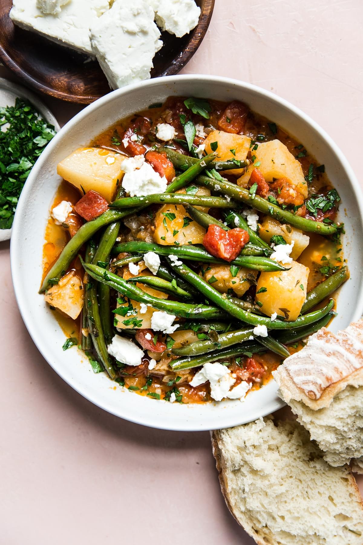 Fasolakia Greek Green Beans with bread, potatoes and tomatoes
