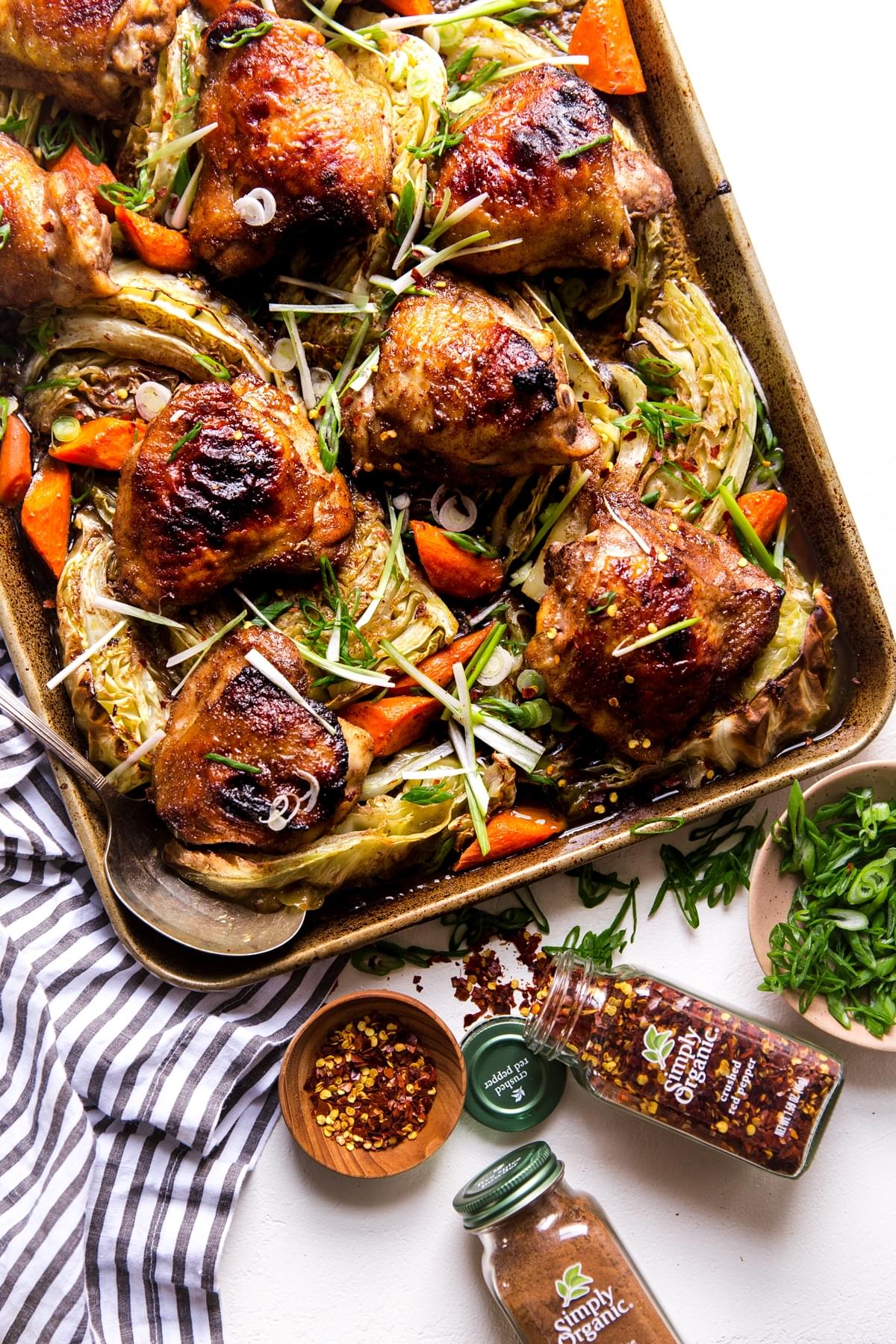 Five Spice Sheet Pan Dinner With Cabbage And Carrots with spices a spoon and a linen