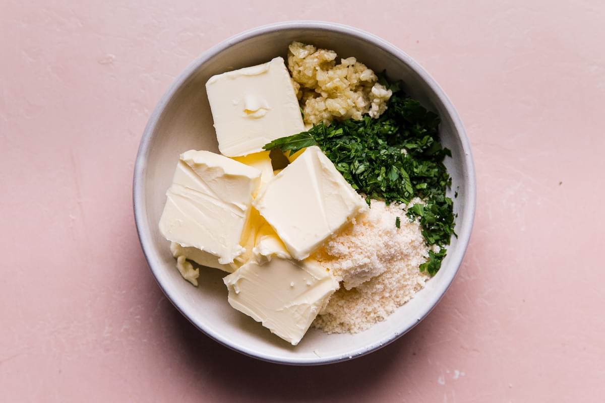 butter, garlic, parmesan cheese, fresh parsley and salt in a medium sized bowl