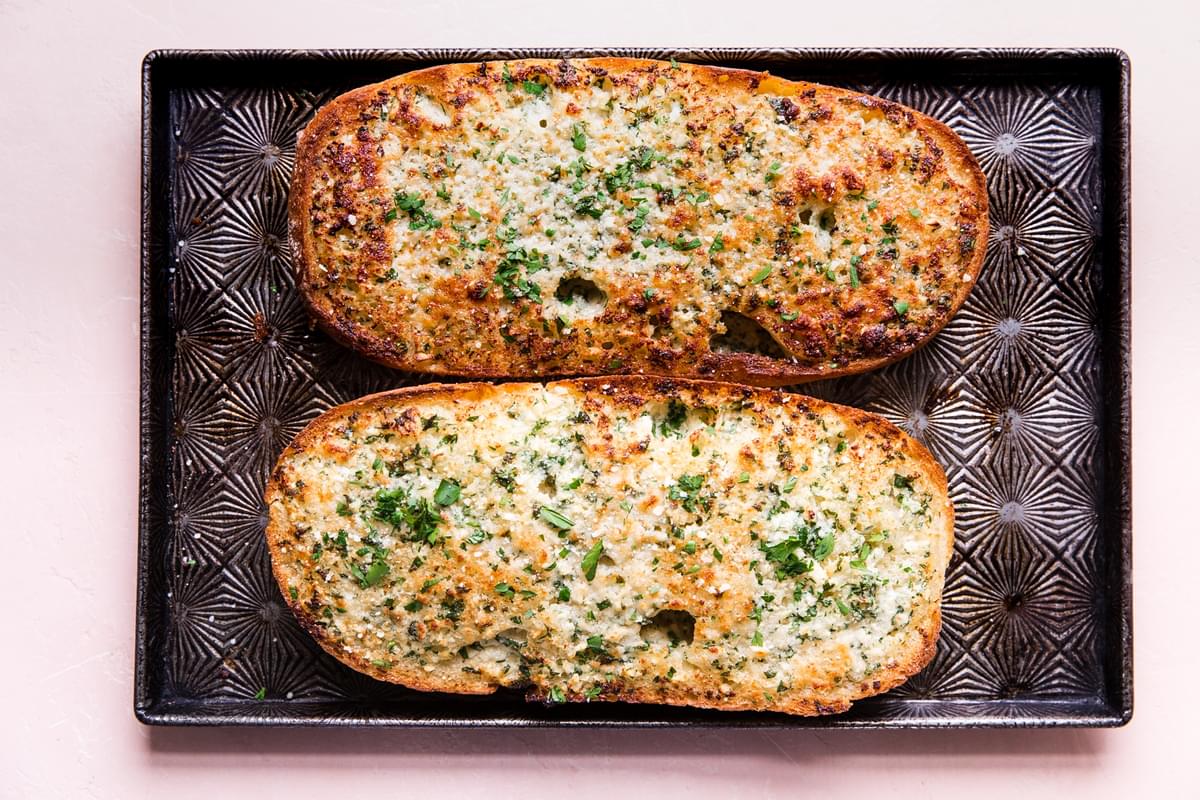 baked garlic bread loaf on a baking sheet