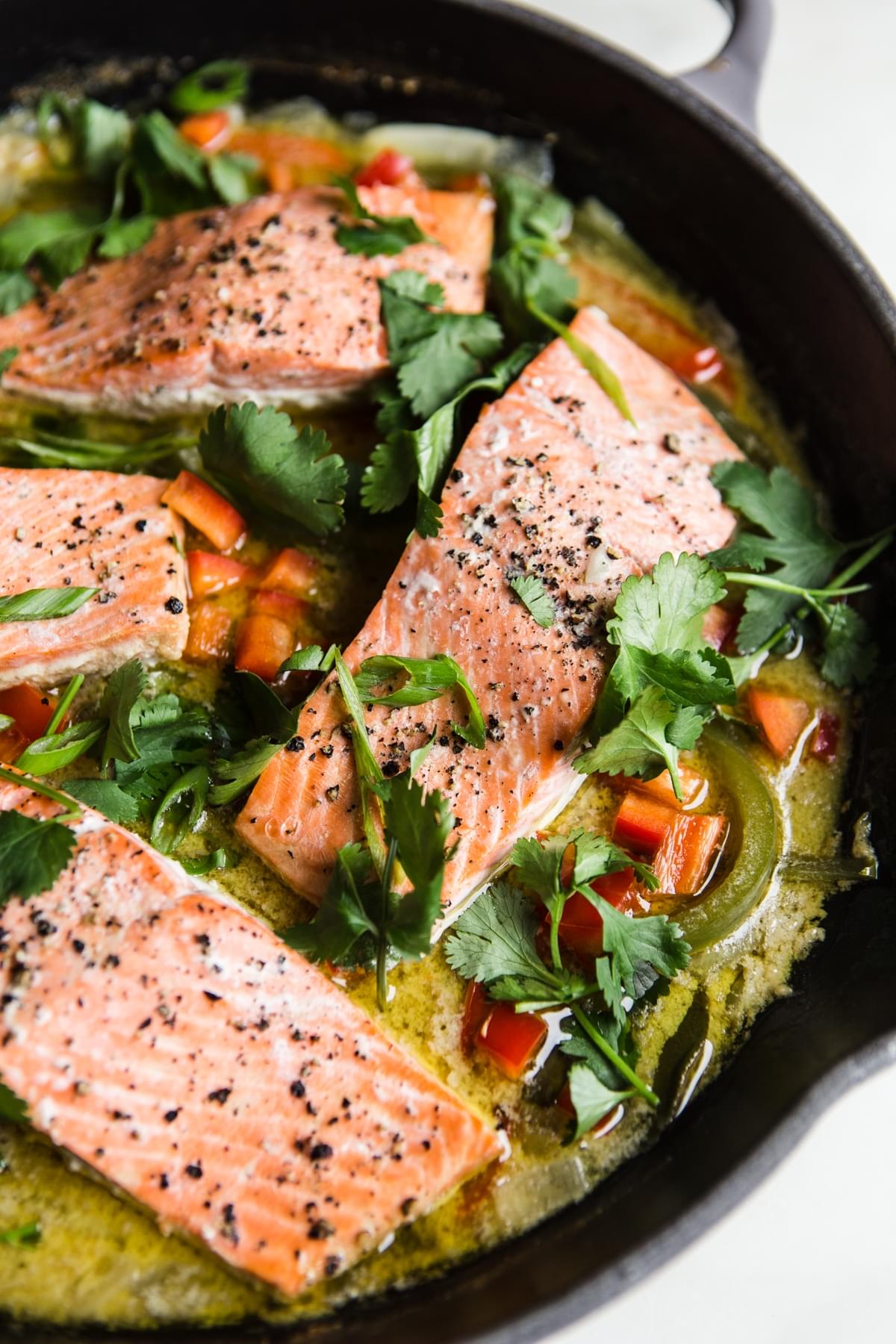 Green Curry Salmon with red peppers and cilantro in a pan whole 30 diet meals