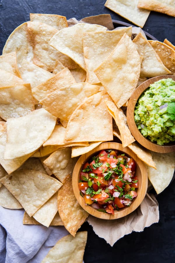 a plate of Homemade Tortilla Chips with salsa and guacamole