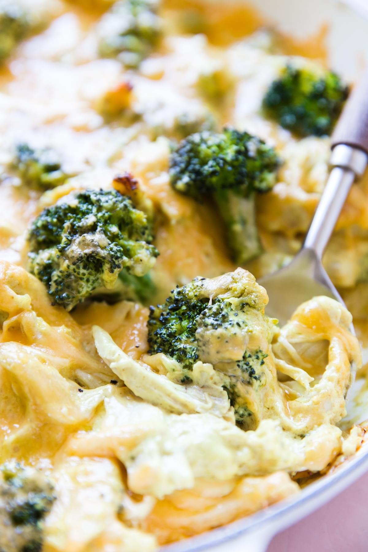 close up of melted cheese over broccoli, shredded chicken, cheddar cheese, keto chicken divan