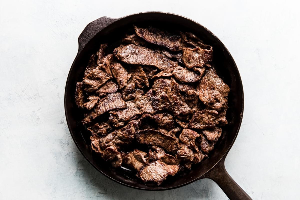 Steak searing in a pan