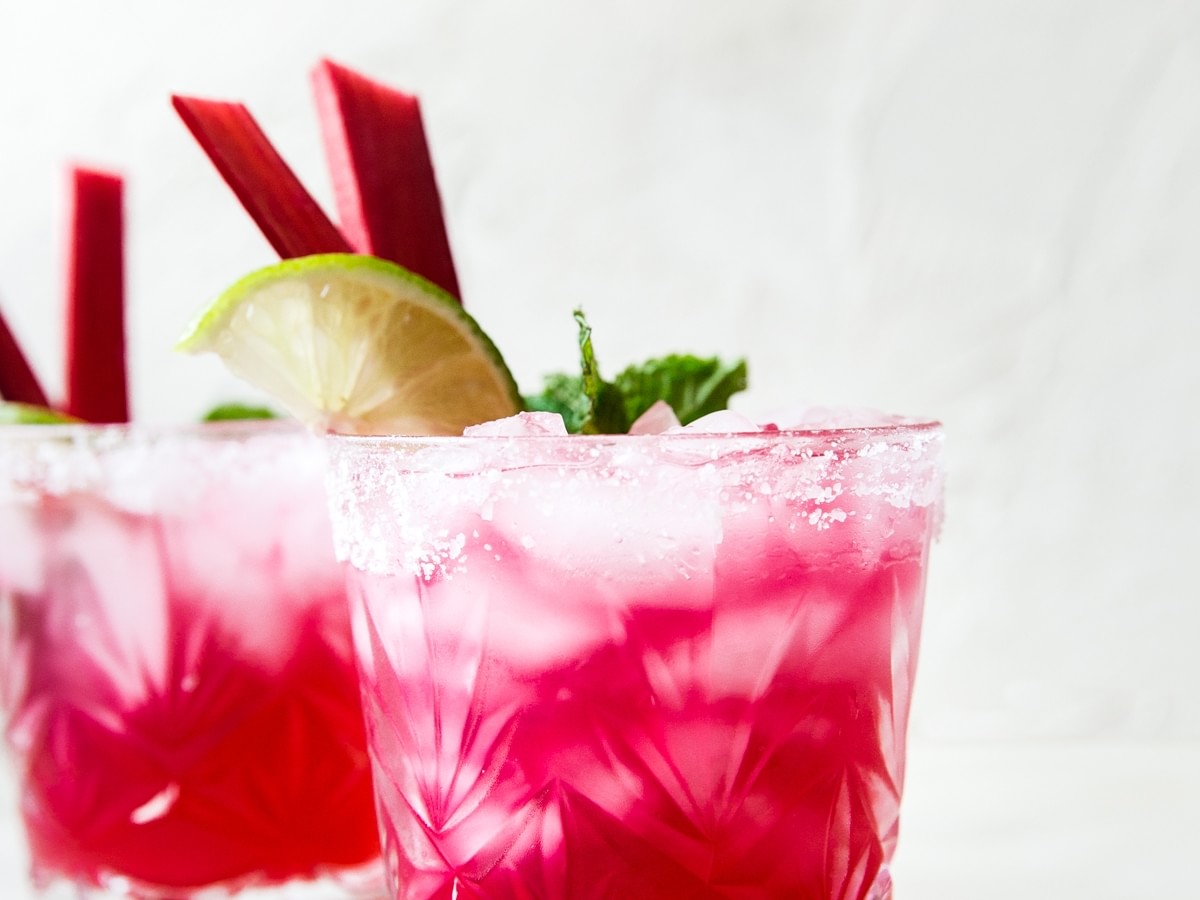 bright pink Rhubarb Mint Margarita with Jalapeño Tequila with lime