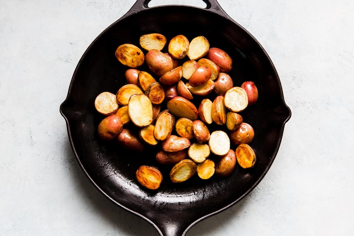baby potatoes in a cast iron skillet