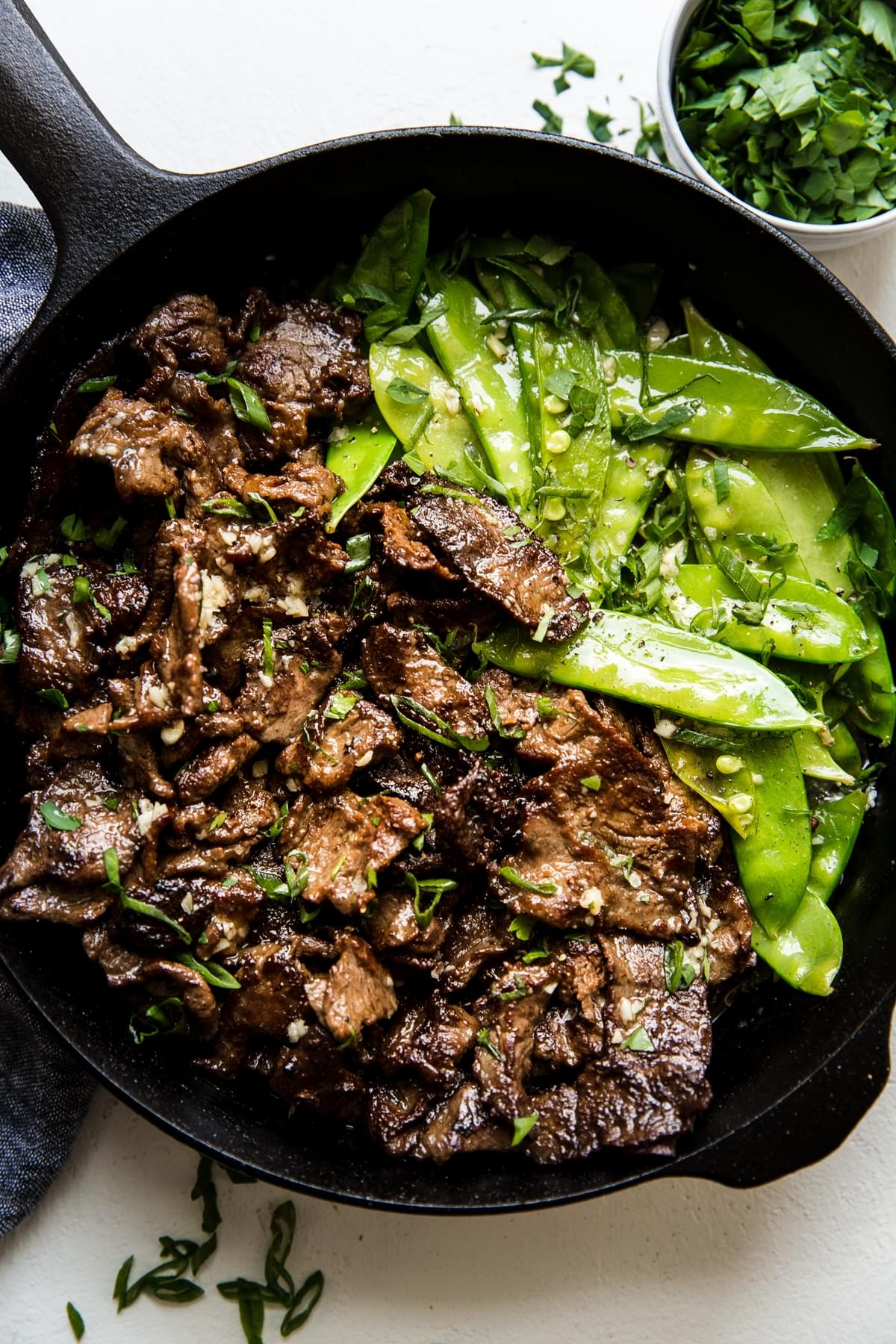 Steak And Snap Pea Garlic Butter Stir Fry with snow peas in a pan