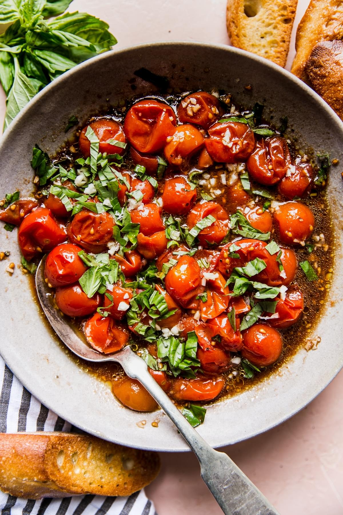 cherry tomato Bruschetta in a bowl with basil and garlic and toasted bread