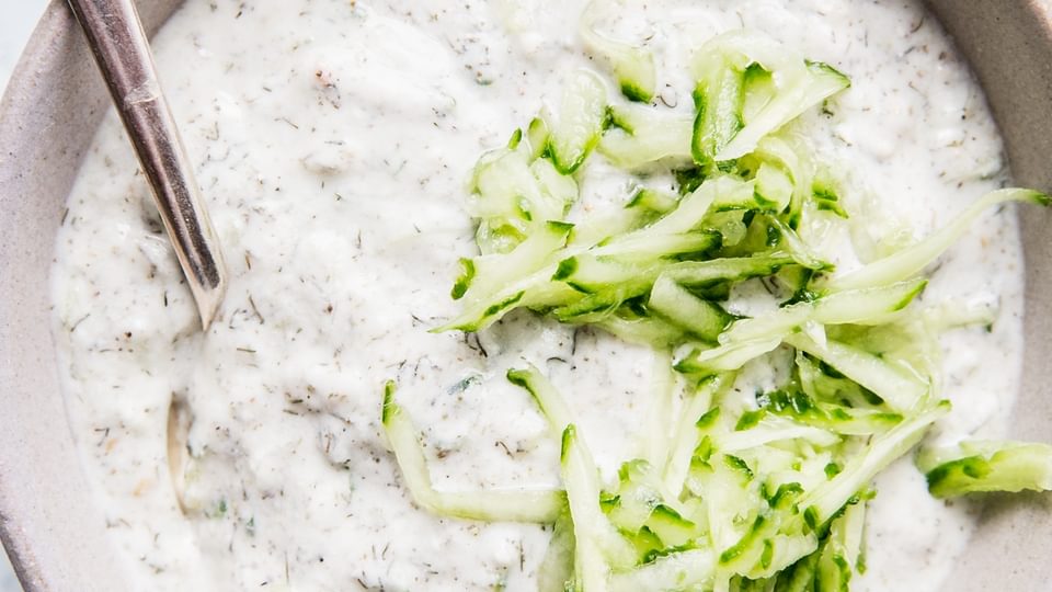 Tzatziki Sauce in a bowl with a spoon