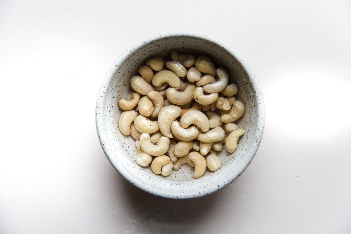 cashews soaking in water in a bowl