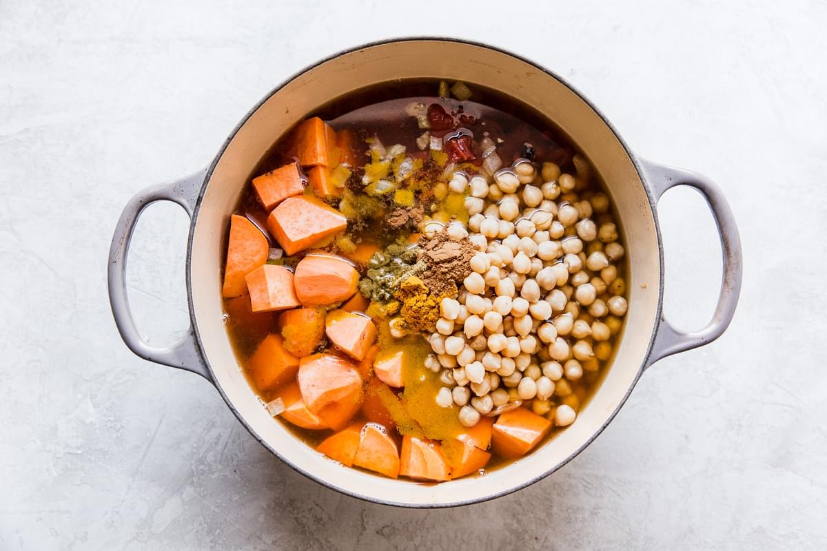 chickpeas, sweet potatoes, broth in a pot