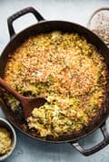 Brussels sprouts gratin with cream, garlic, Parmesan, Gruyère cheeses and toasted bread crumbs in a baking dish