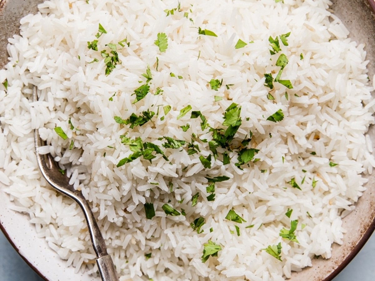 the best coconut rice in a bowl with a spoon