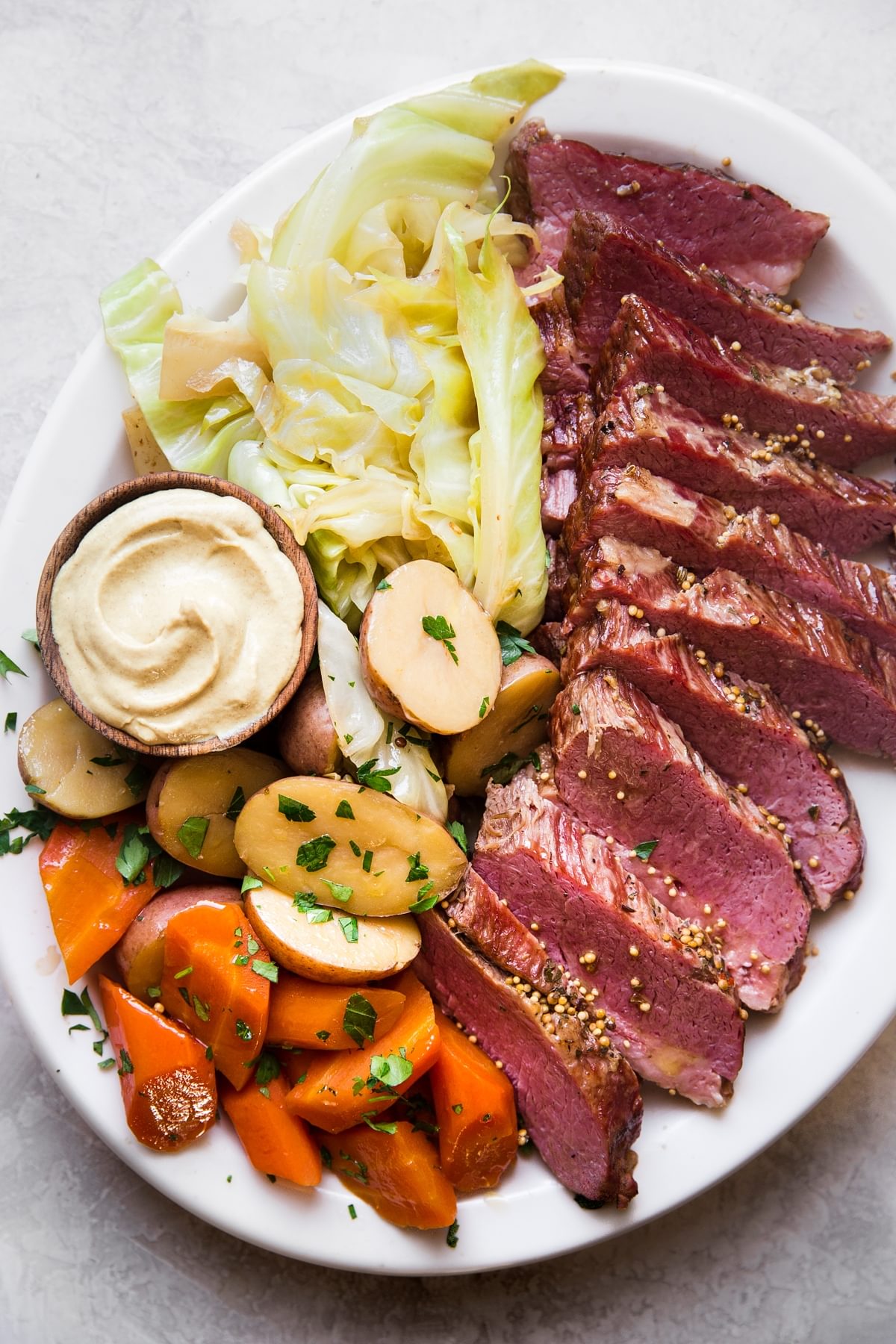 sliced Corned beef with cabbage and potatoes on a plate