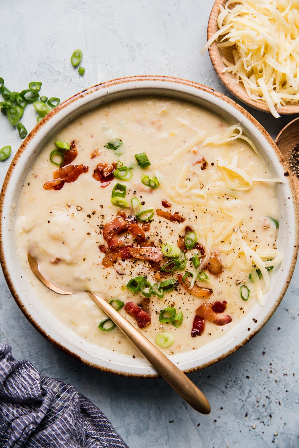 creamy potato soup with leeks, bacon , green onions and white cheddar cheese