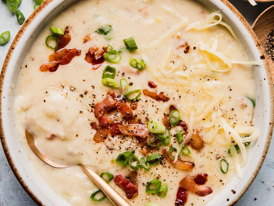 creamy potato soup with leeks, bacon , green onions and white cheddar cheese