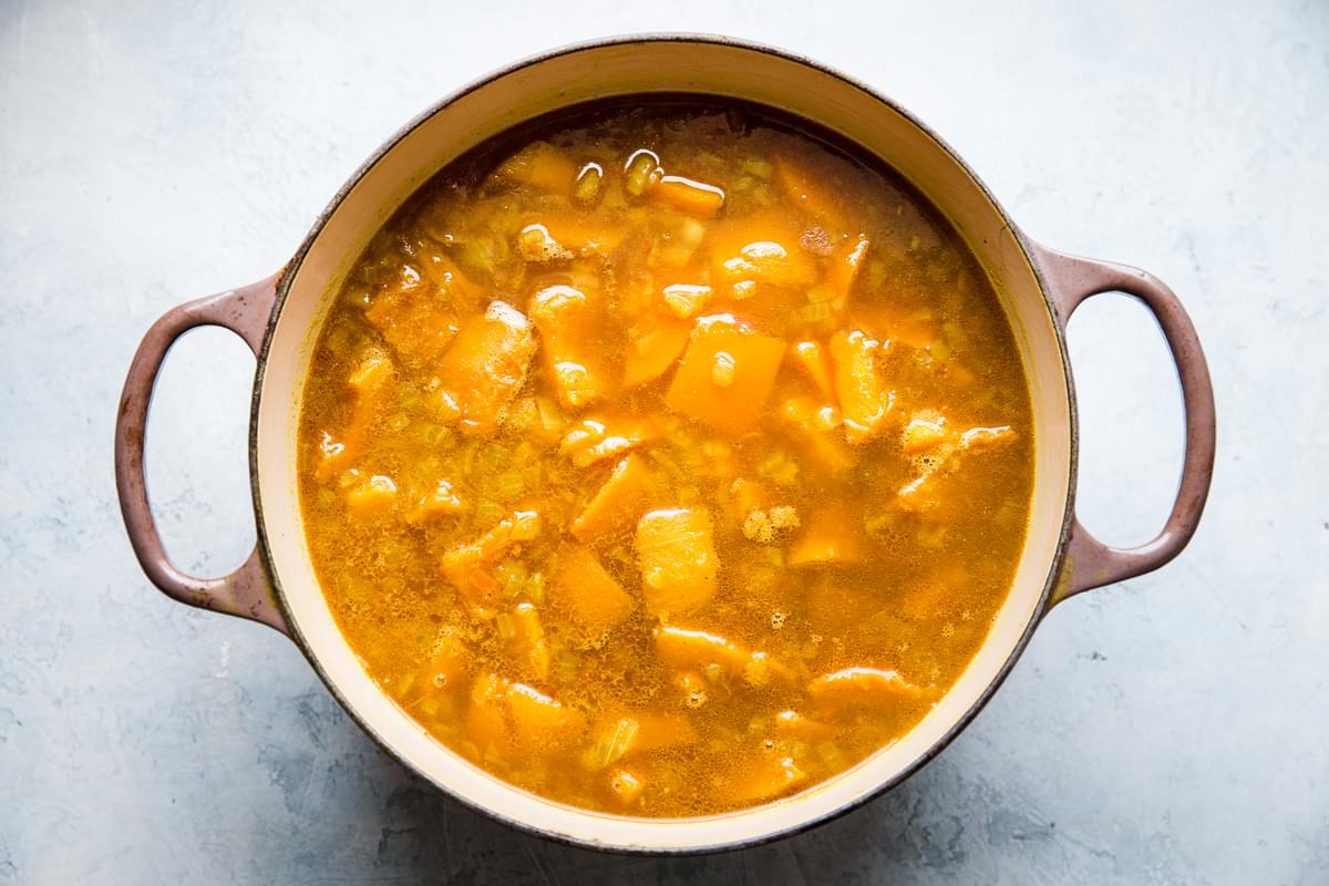 cooked pumpkin and butternut squash in a large pot for pumpkin soup