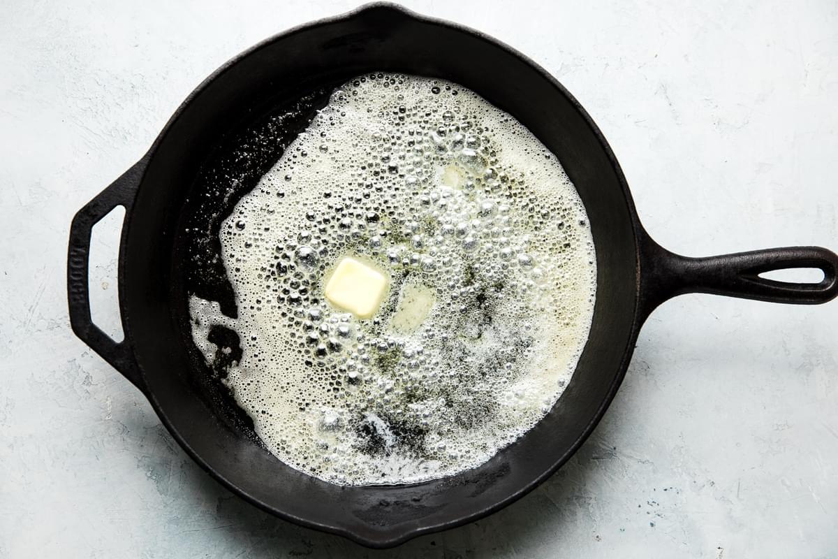 4 tablespoons butter melted in a hot cast iron pan