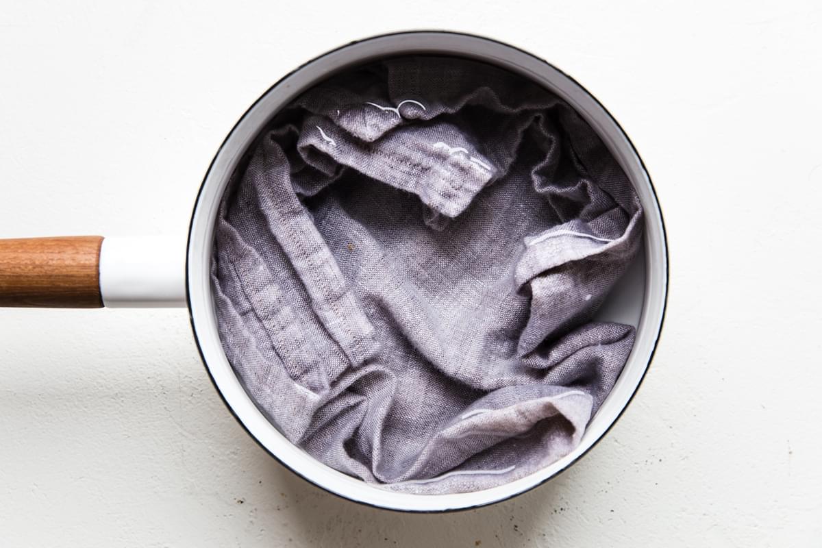 linen in a white pot with water