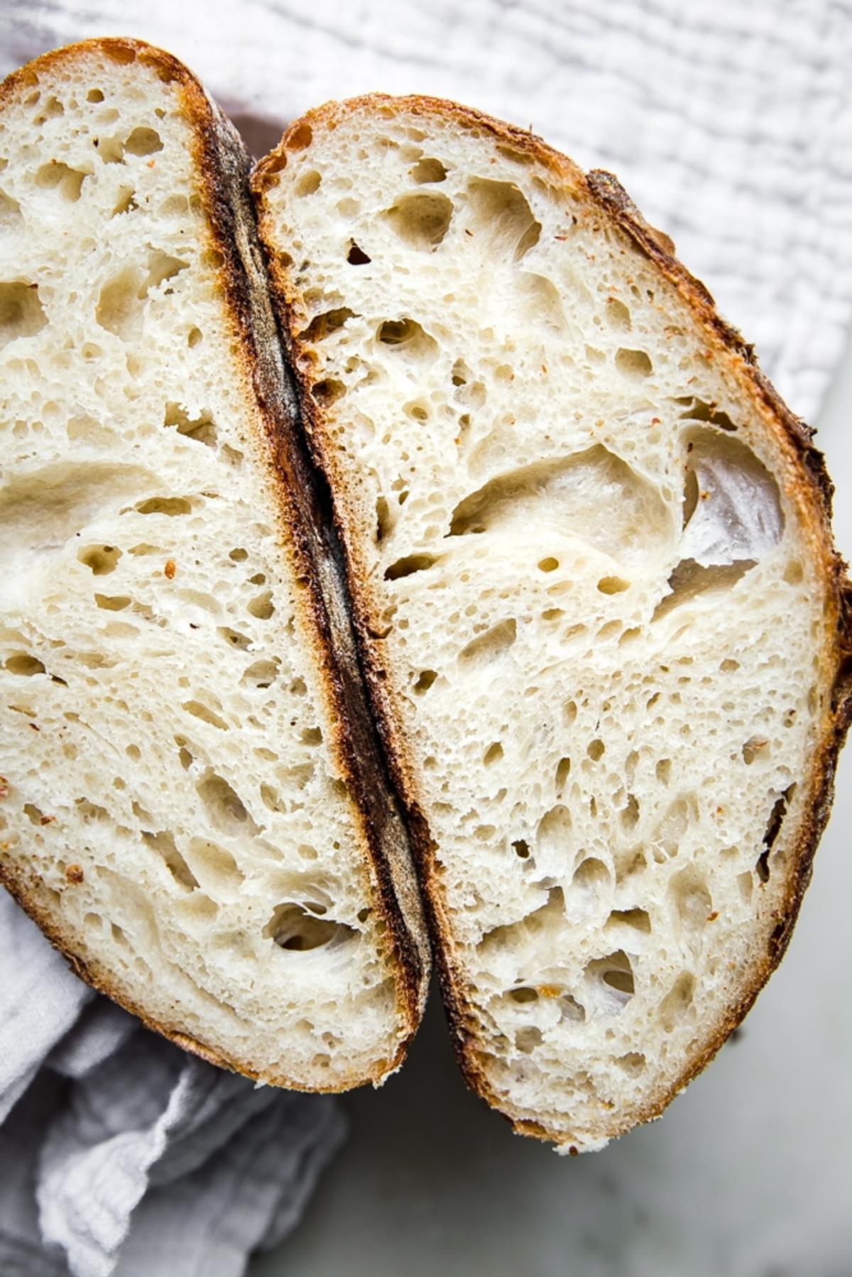 sourdough bread cut in half showing crumb
