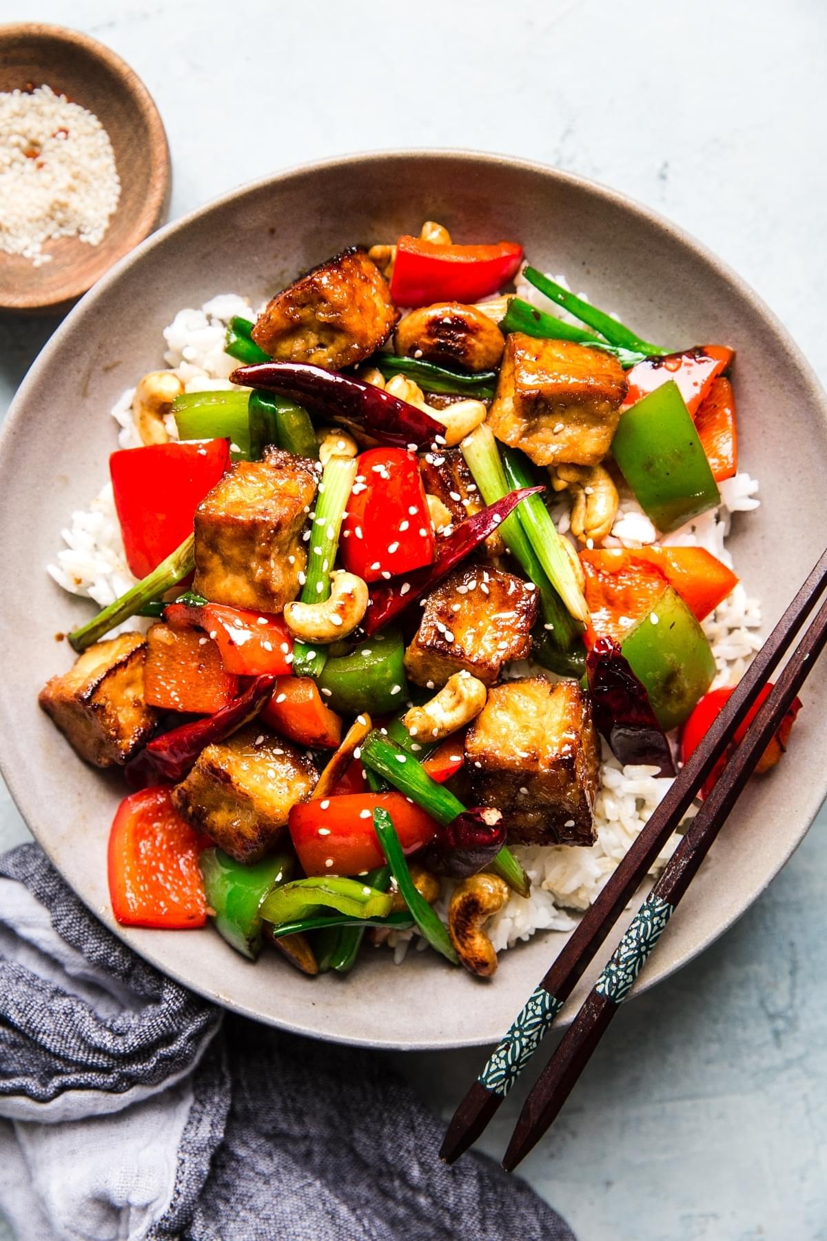 Kung Pao Tofu with red bell peppers, served over rice