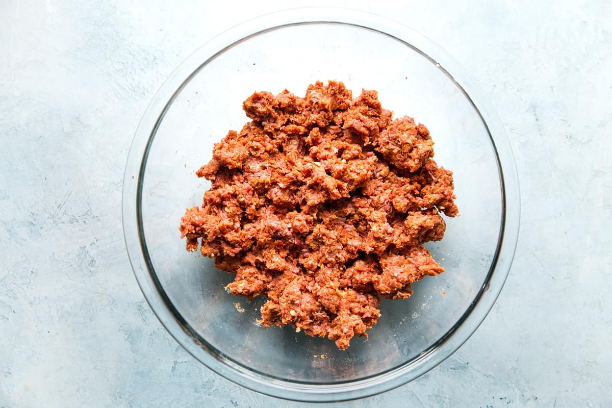ground beef mixed with spices for shakshuka style meatballs