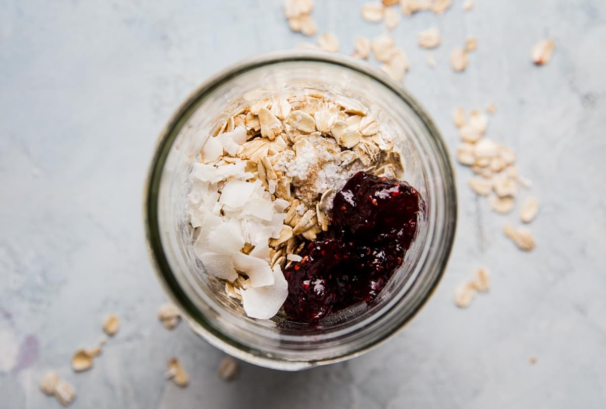 ingredients for blackberry overnight oats in a glass jar