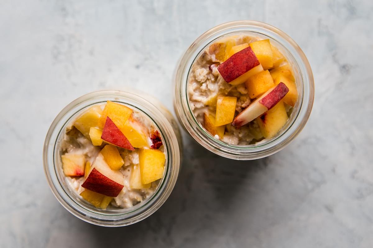 Peaches and Cream overnight oats in glass jars
