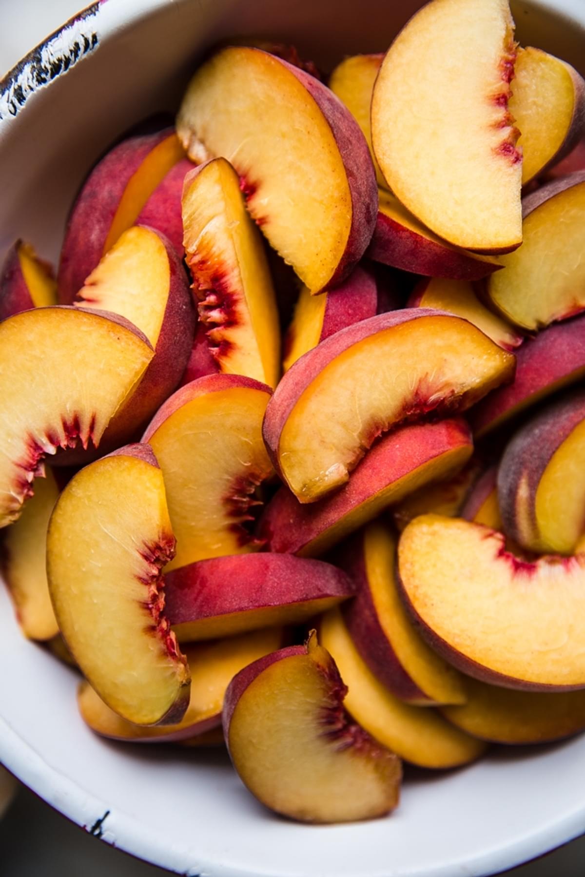 sliced yellow peaches in a bowl