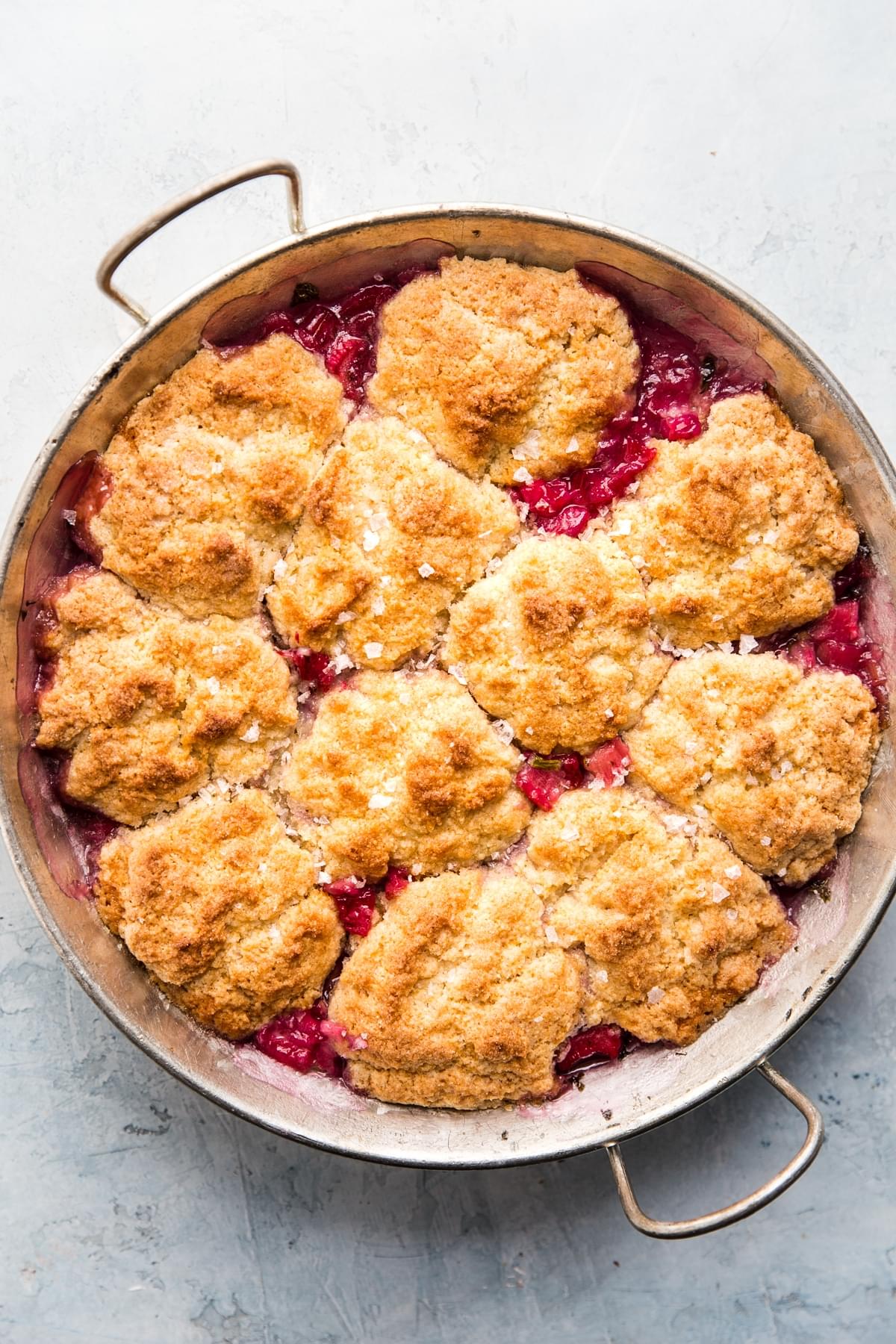 rhubarb cobbler with mint in a round baking dish