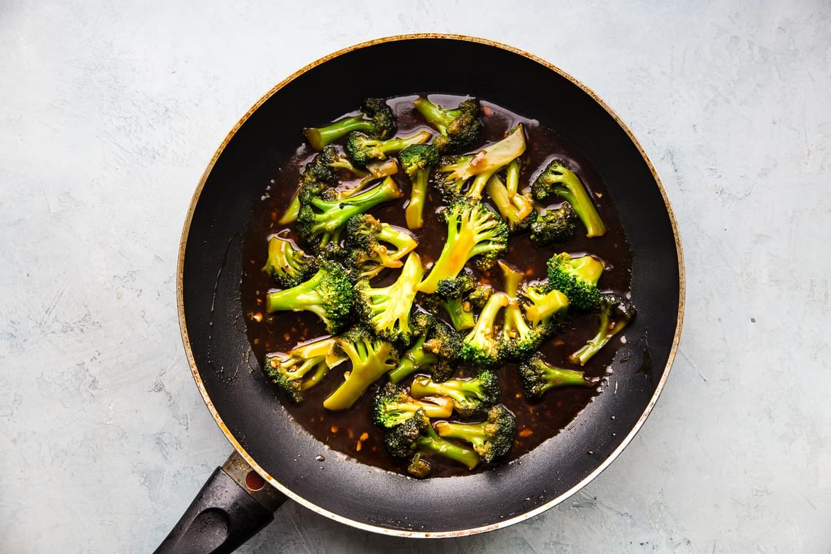 broccoli in a pan with sesame sauce