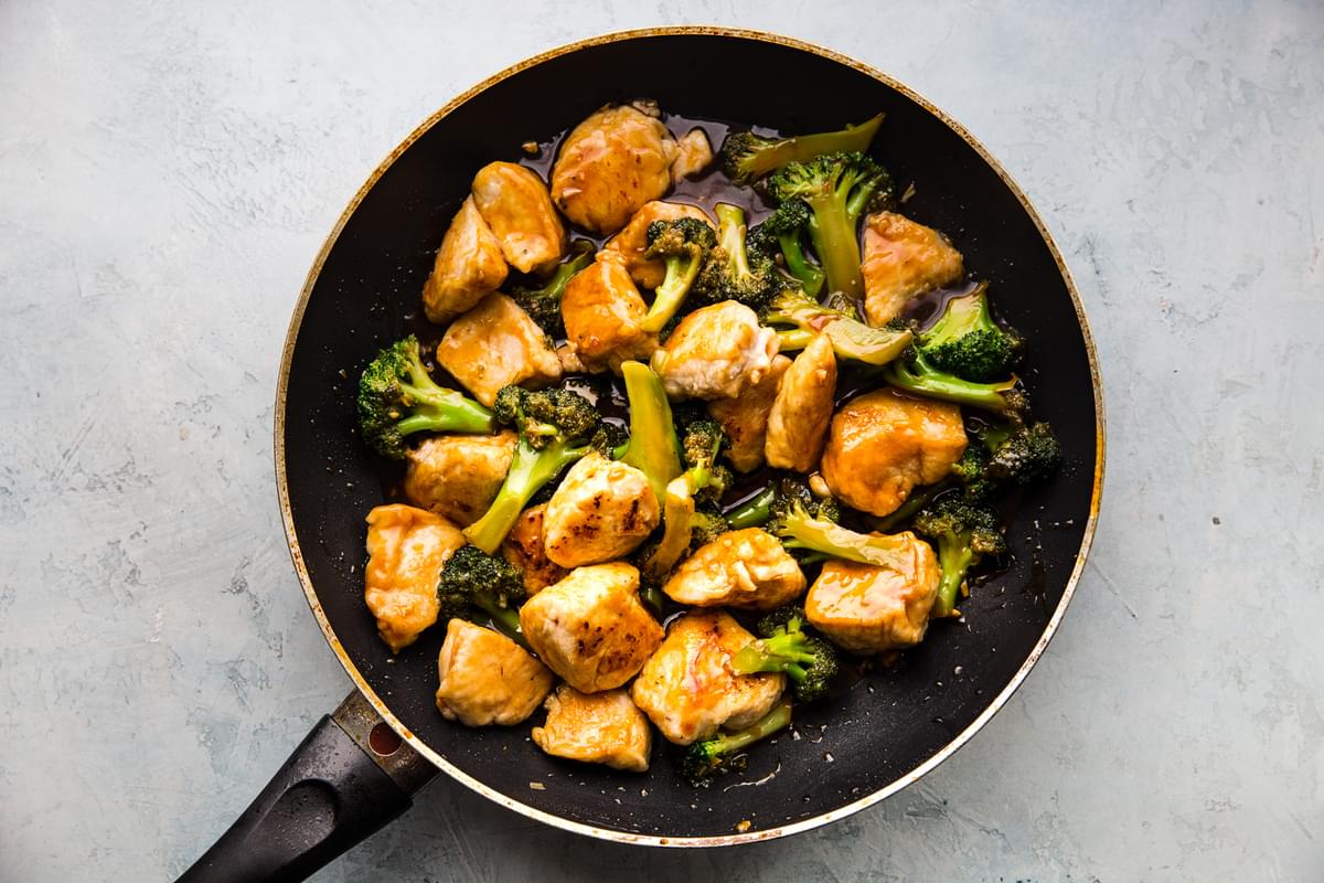 sesame chicken with broccoli in a pan