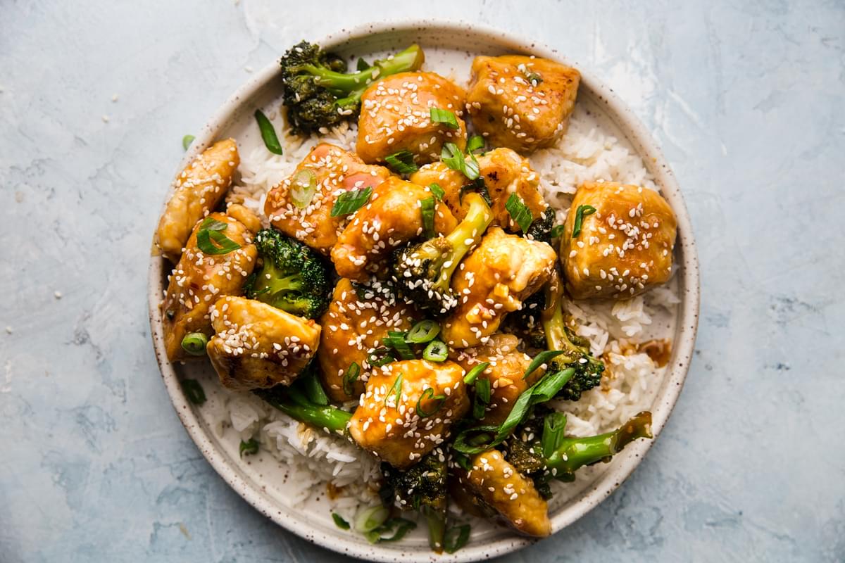 Sesame Chicken with Broccoli and rice on a plate