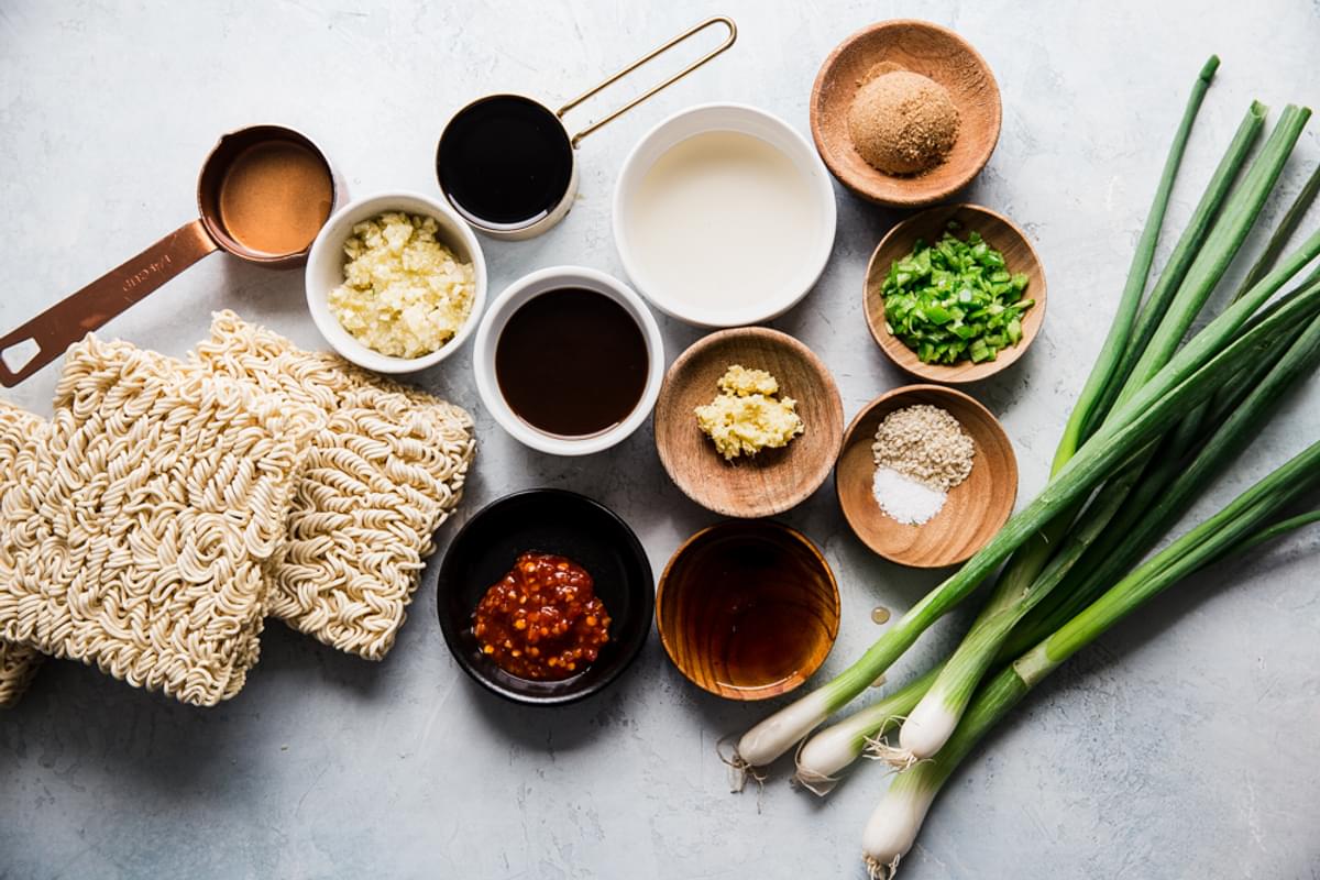 ingredients for sesame garlic ramen noodles green onions, brown sugar, soy sauce.
