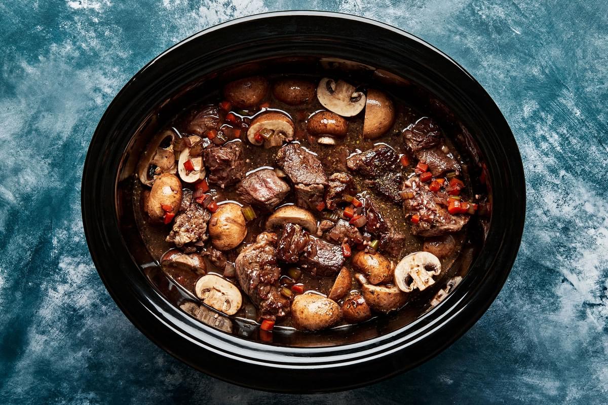 browned beef, cook vegetables, beef stock and red wine in a slow cooker
