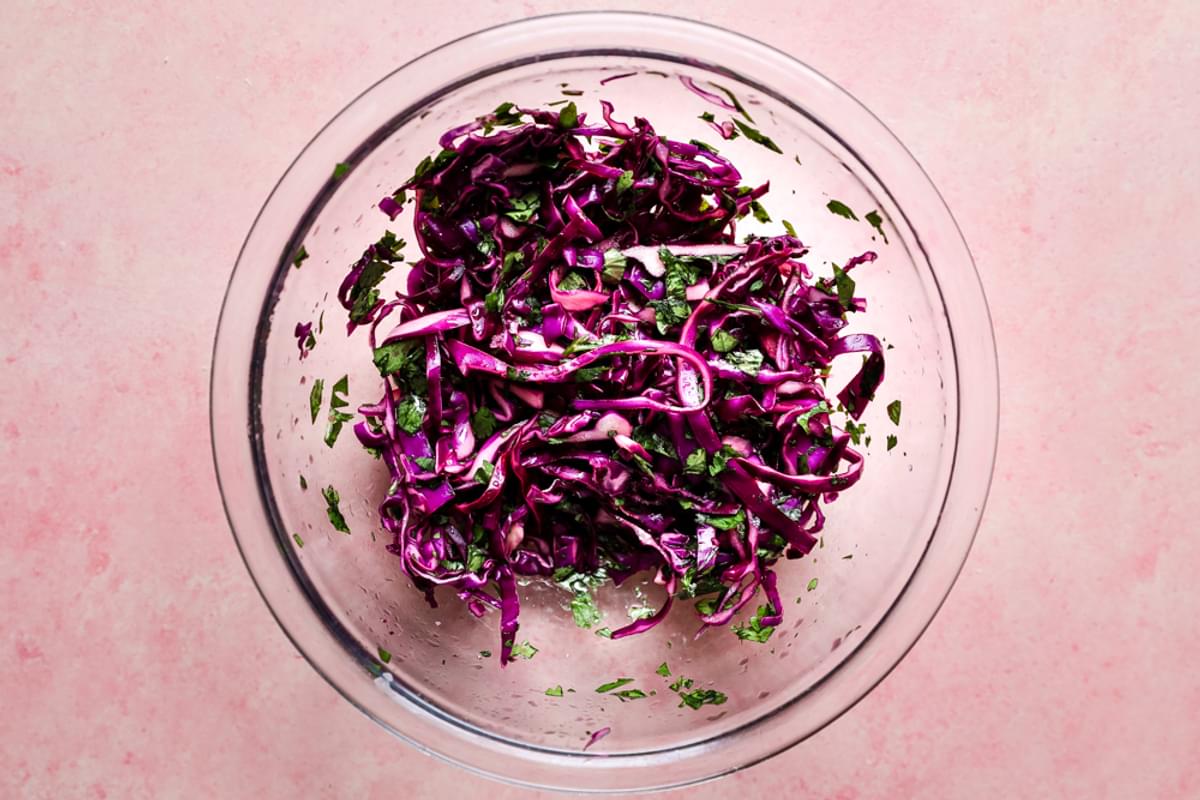 red cabbage and cilantro slaw in a bowl
