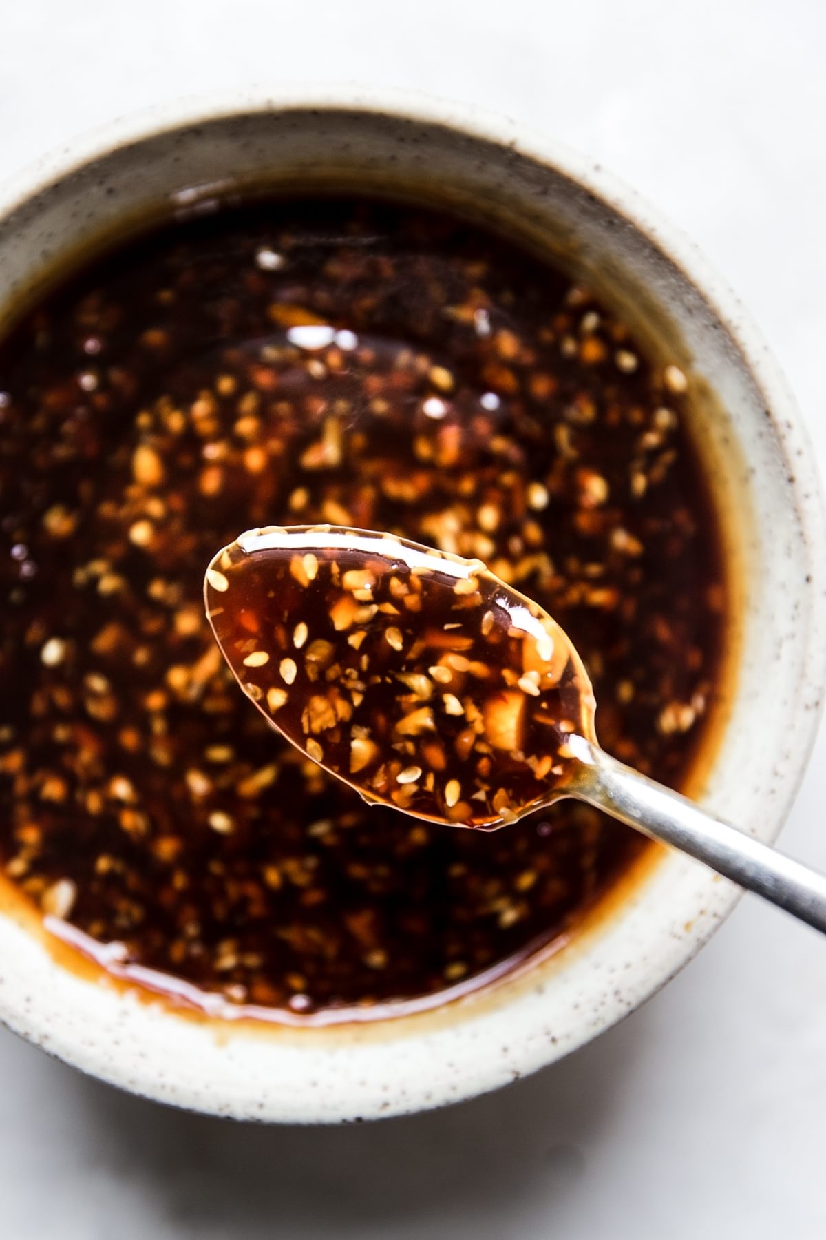teriyaki sauce with ginger and garlic in a bowl with a spoon