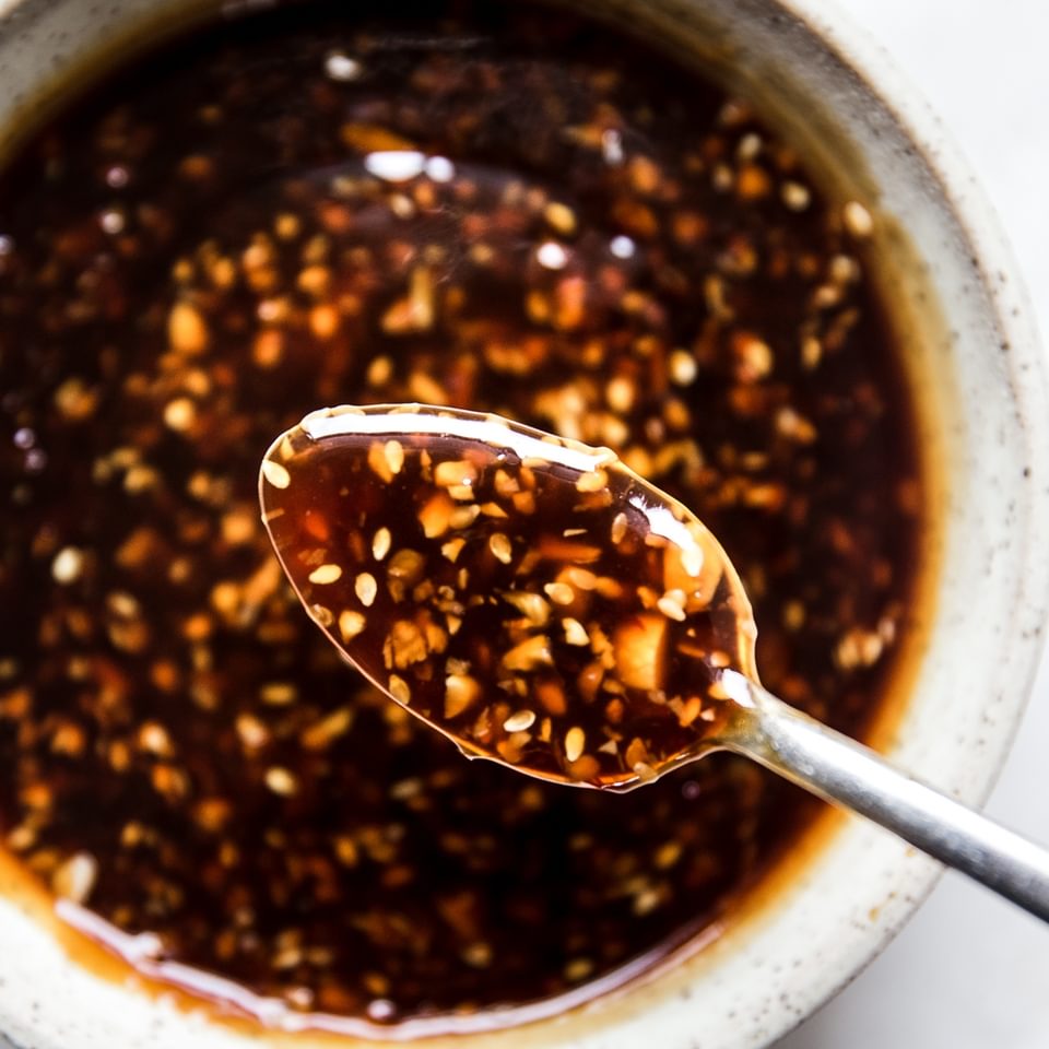 teriyaki sauce with ginger and garlic in a bowl with a spoon